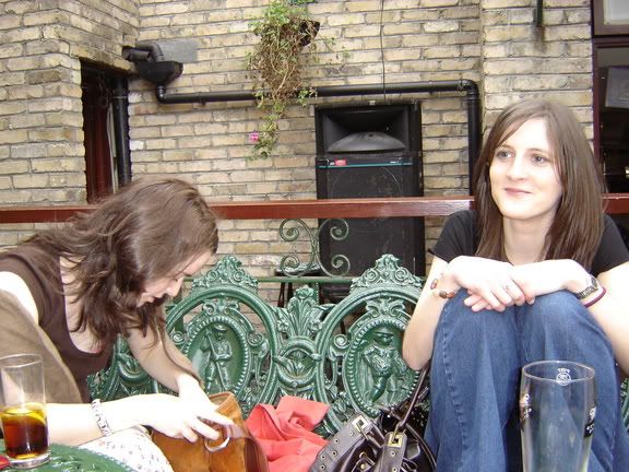 Amanda searches for lipstick while Emma keeps watch for handsome men