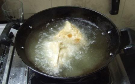 Frying samosas