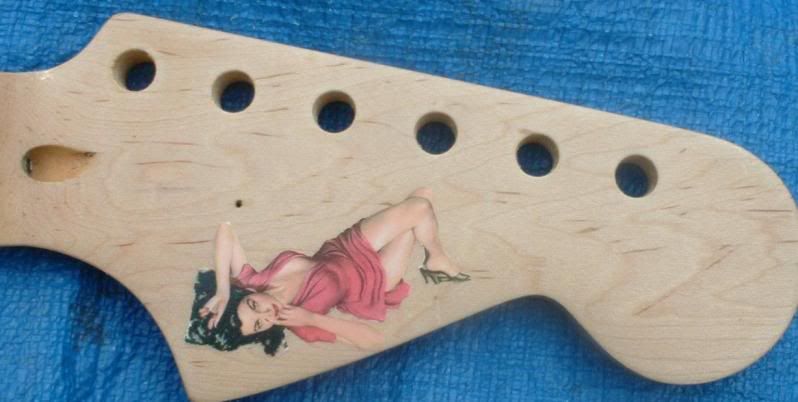 http://i3.photobucket.com/albums/y67/silenceisconsent/guitar/cigarbox025aaaa.jpg