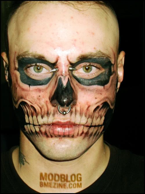 Spider tattooed on groom's face. This guy is