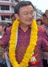 El amigo Thaksin de fiesta hawaiana