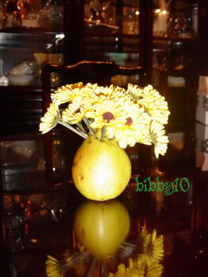 close up of flowers stuck in a pear - given to me by my principal